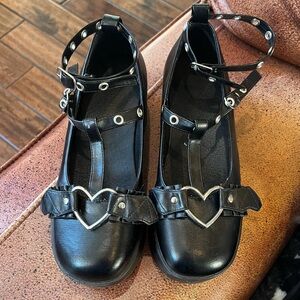 Black Heart platform Buckle Mary Janes size 6.5. Small flaw shown in last photo.